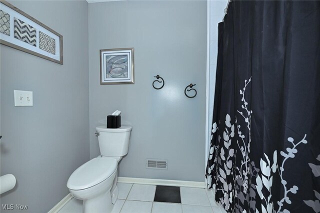 1152 Terraho Dr, Salem, OH 44460 - full bath with toilet, baseboards, tile patterned flooring, and curtained shower