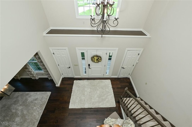 1152 Terraho Dr, Salem, OH 44460 - foyer with a chandelier, a high ceiling, plenty of natural light, wood finished floors, and baseboards