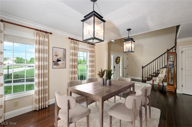 1152 Terraho Dr, Salem, OH 44460 - dining space featuring a chandelier, dark wood-type flooring, baseboards, ornamental molding, and healthy amount of natural light