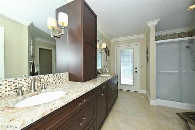 1152 Terraho Dr, Salem, OH 44460 - bathroom featuring ornamental molding, a shower stall, double vanity, baseboards, and backsplash