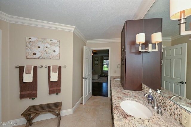 1152 Terraho Dr, Salem, OH 44460 - bathroom featuring crown molding, baseboards, vanity, and a textured ceiling