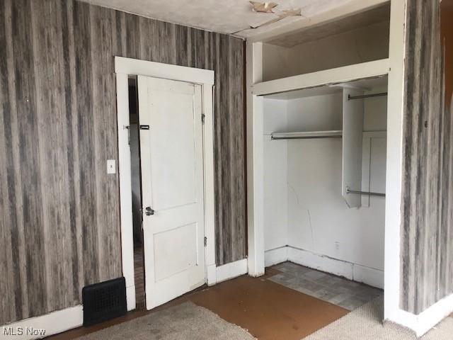 2117 Maple Ave NE, Canton, OH 44714 - unfurnished bedroom with a closet