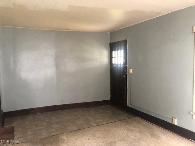 2117 Maple Ave NE, Canton, OH 44714 - spare room with baseboards and carpet flooring