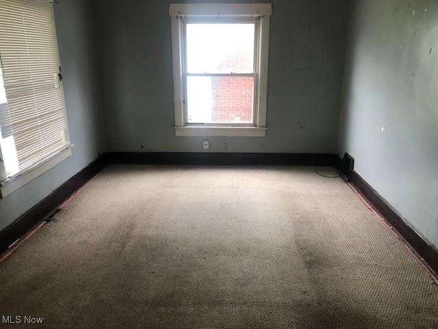2117 Maple Ave NE, Canton, OH 44714 - empty room featuring carpet floors and baseboards
