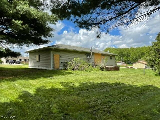 362 Jettie Ave NE, East Canton, OH 44730 - view of property exterior featuring a lawn