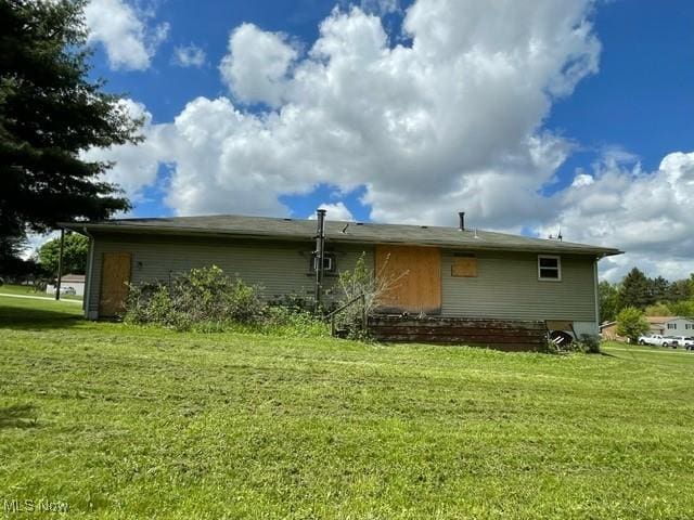 362 Jettie Ave NE, East Canton, OH 44730 - back of property featuring a yard