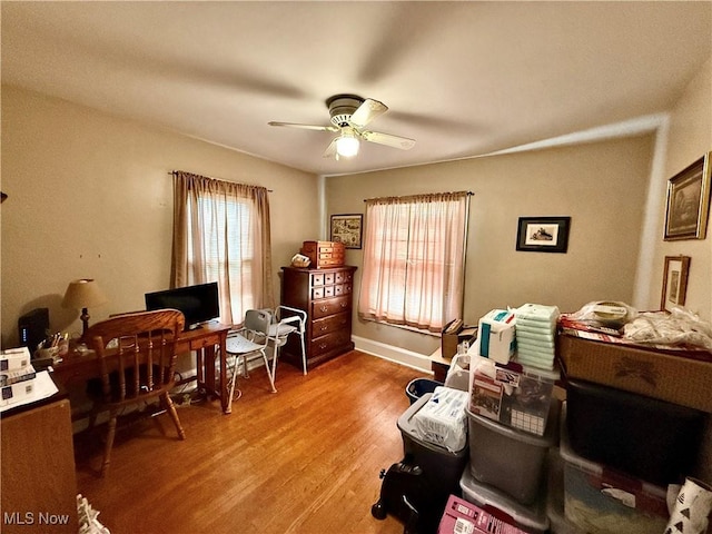 home office featuring a ceiling fan and light wood-style floors