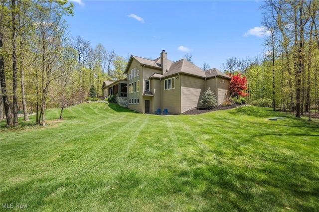 15020 Steelhead Run, Chardon, OH 44024 - view of property exterior featuring a chimney and a lawn