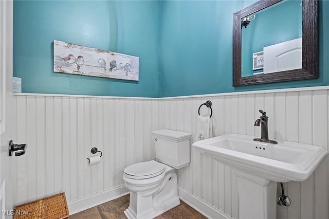 15020 Steelhead Run, Chardon, OH 44024 - bathroom with wainscoting and toilet