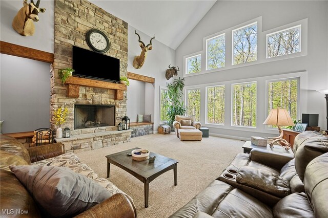 15020 Steelhead Run, Chardon, OH 44024 - carpeted living area with high vaulted ceiling and a stone fireplace