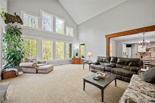 15020 Steelhead Run, Chardon, OH 44024 - living room featuring high vaulted ceiling, carpet, and a chandelier