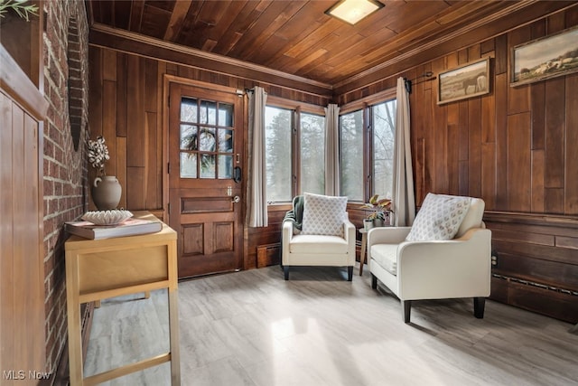 555 E Milton St, Alliance, OH 44601 - living area featuring wood walls, wooden ceiling, plenty of natural light, and crown molding
