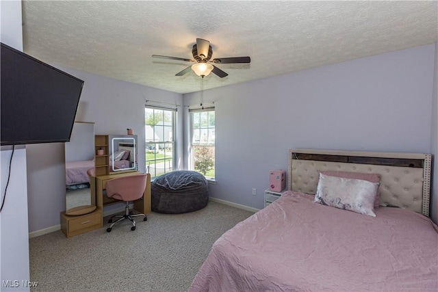 bedroom with baseboards, a textured ceiling, carpet floors, and ceiling fan