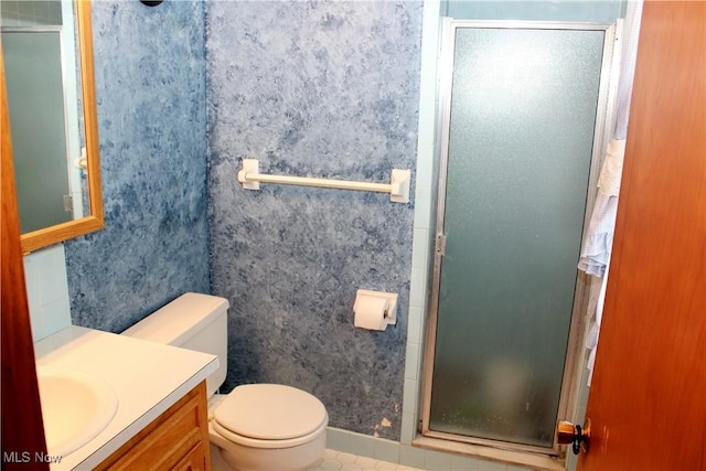 6995 Ron Park Pl, Boardman, OH 44512 - full bathroom with a shower stall, vanity, and toilet
