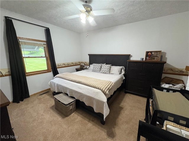 11153 Pleasant Rd, Pleasant City, OH 43772 - bedroom with light carpet, a textured ceiling, and a ceiling fan