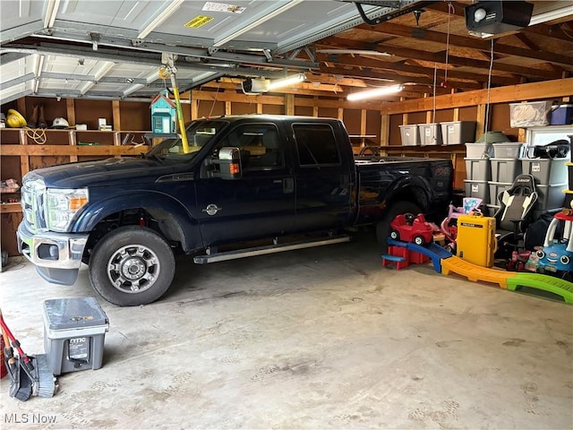 11153 Pleasant Rd, Pleasant City, OH 43772 - garage featuring a garage door opener