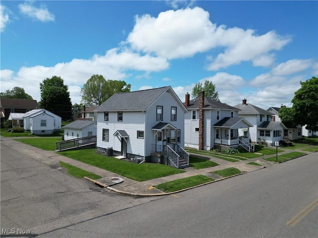 1327 Orange St, Coshocton, OH 43812 - view of property with a residential view, a front lawn, and a shingled roof