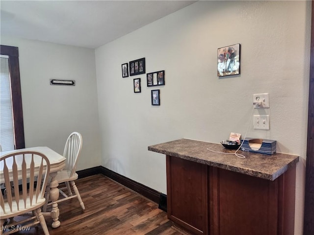 1327 Orange St, Coshocton, OH 43812 - dining space with dark wood-style flooring and baseboards