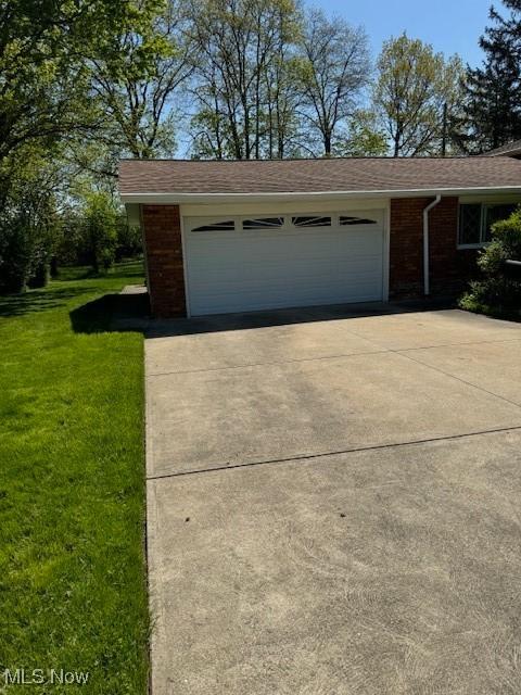 5699 Meadow Ln, Bedford Heights, OH 44146 - garage featuring concrete driveway
