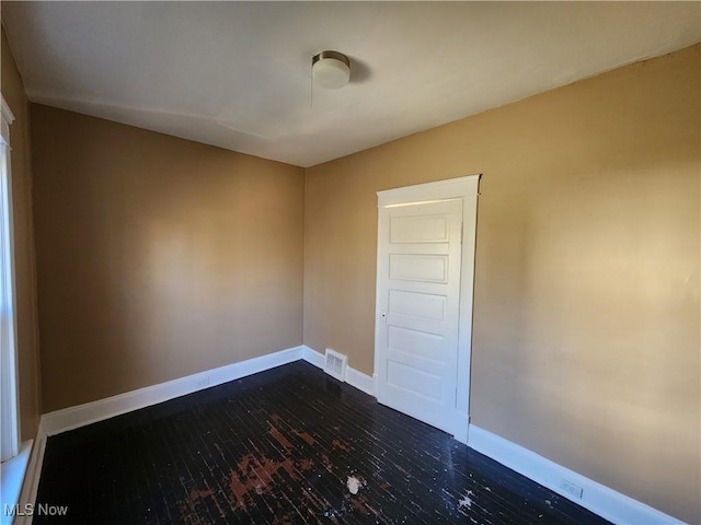 2906-2908 E 104th St, Cleveland, OH 44104 - spare room featuring baseboards and dark wood finished floors