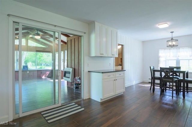 31 Garden Park Dr, Chagrin Falls, OH 44022 - kitchen with white cabinetry, dark wood-style floors, heating unit, and dark countertops