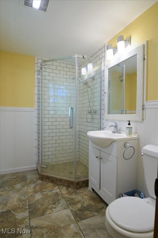 31 Garden Park Dr, Chagrin Falls, OH 44022 - full bath featuring toilet, a stall shower, vanity, and wainscoting