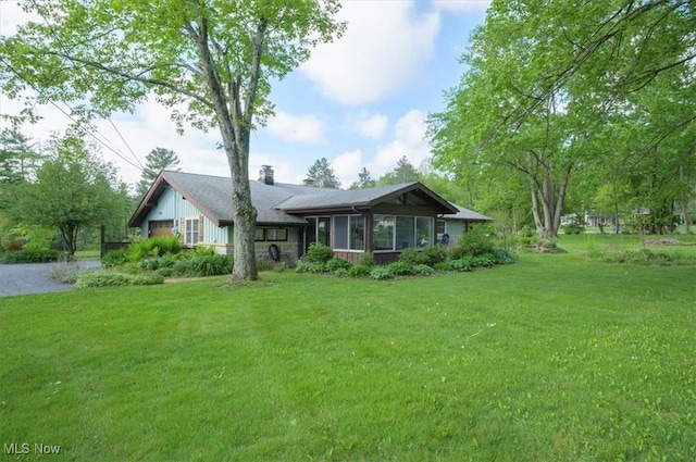 31 Garden Park Dr, Chagrin Falls, OH 44022 - view of front of home with driveway, a front yard, and a chimney