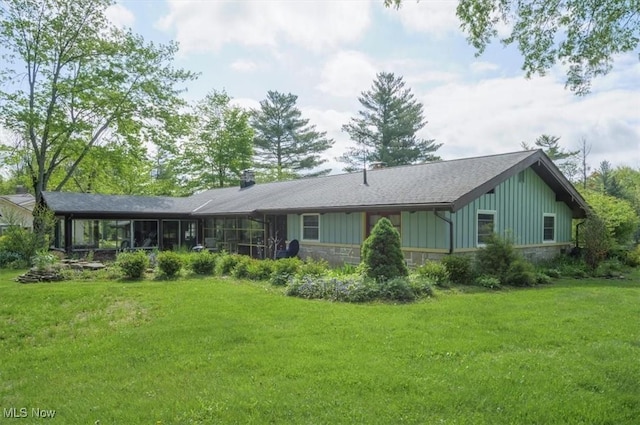 31 Garden Park Dr, Chagrin Falls, OH 44022 - rear view of property with stone siding, a yard, and board and batten siding