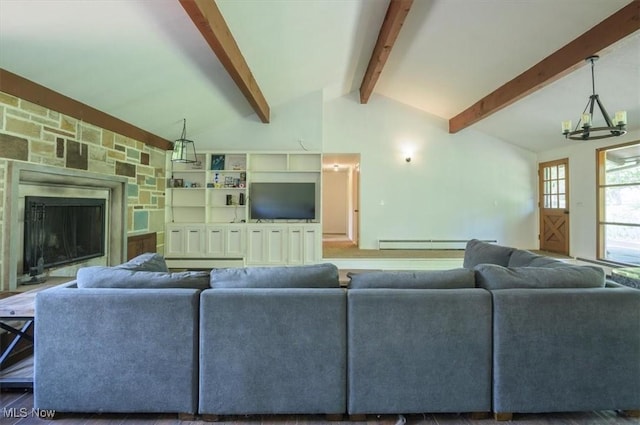 31 Garden Park Dr, Chagrin Falls, OH 44022 - living room featuring baseboard heating, a fireplace, and a chandelier
