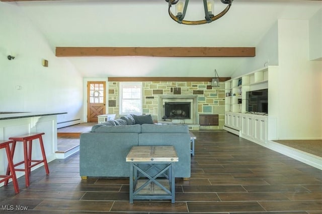 31 Garden Park Dr, Chagrin Falls, OH 44022 - living area featuring a baseboard radiator, wood finish floors, a chandelier, and a stone fireplace