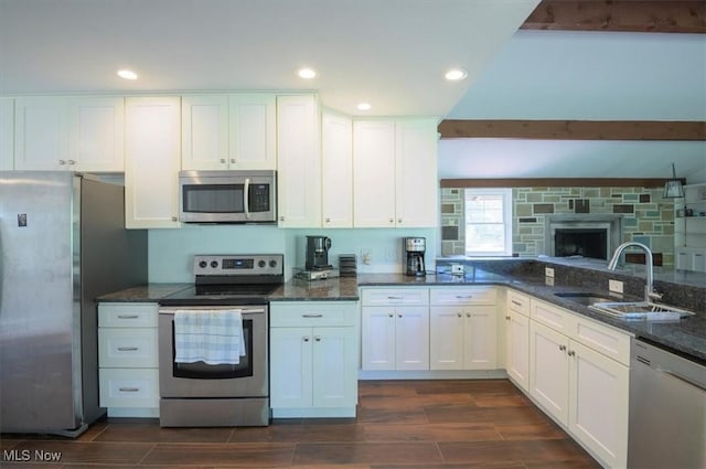 31 Garden Park Dr, Chagrin Falls, OH 44022 - kitchen featuring appliances with stainless steel finishes, a sink, dark wood finished floors, white cabinets, and recessed lighting