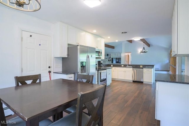 31 Garden Park Dr, Chagrin Falls, OH 44022 - dining area featuring dark wood-style floors, vaulted ceiling, recessed lighting, a baseboard radiator, and a chandelier