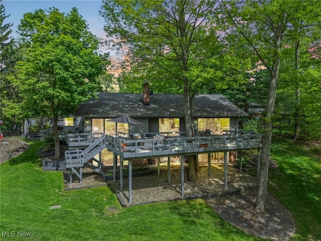 540 Bent Creek Oval, Aurora, OH 44202 - rear view of property with a deck, stairway, a lawn, and a chimney