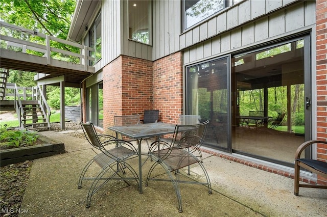540 Bent Creek Oval, Aurora, OH 44202 - view of patio / terrace featuring stairs and outdoor dining space
