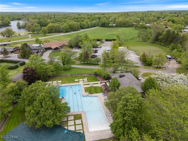 540 Bent Creek Oval, Aurora, OH 44202 - drone / aerial view of a pool, a nearby body of water, and a forest