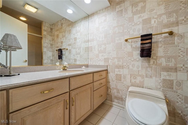 540 Bent Creek Oval, Aurora, OH 44202 - full bath featuring tile patterned floors, toilet, vanity, and baseboards