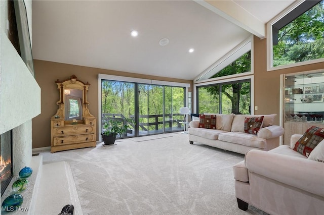 540 Bent Creek Oval, Aurora, OH 44202 - carpeted living area featuring high vaulted ceiling, beam ceiling, plenty of natural light, a premium fireplace, and recessed lighting