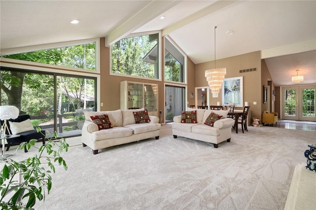 540 Bent Creek Oval, Aurora, OH 44202 - carpeted living room featuring high vaulted ceiling, a chandelier, beam ceiling, and french doors