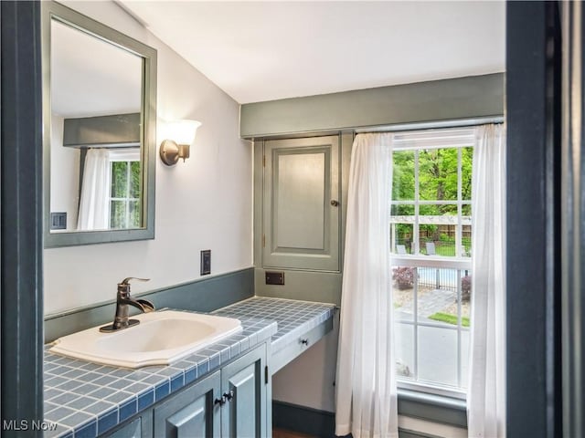bathroom featuring plenty of natural light and vanity