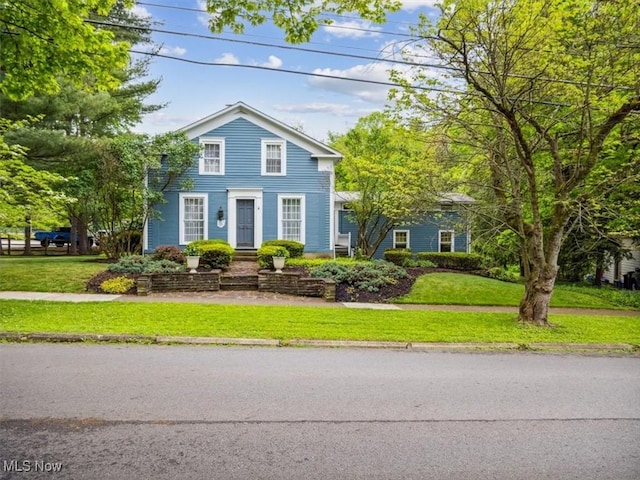 view of front of home with a front yard