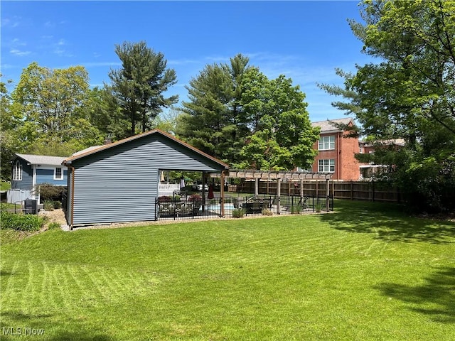 view of yard with a pool, central AC unit, and a patio