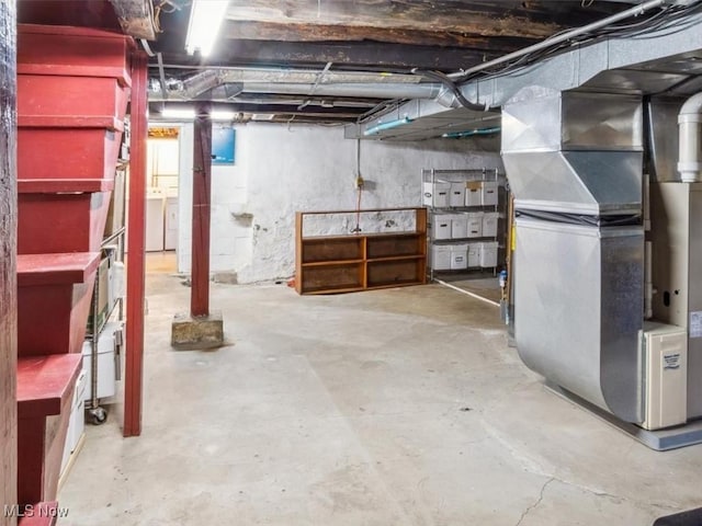 unfinished below grade area featuring heating unit