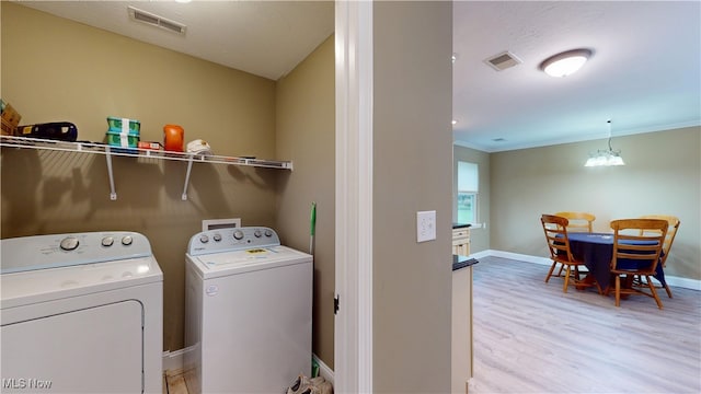 416 Elm St Unit B, Belpre, OH 45714 - clothes washing area with washer and dryer, light wood-style flooring, baseboards, and ornamental molding