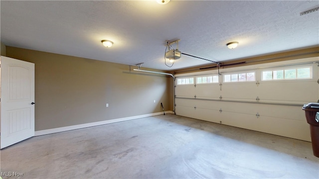 416 Elm St Unit B, Belpre, OH 45714 - garage featuring a garage door opener and baseboards