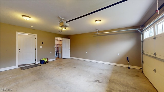 416 Elm St Unit B, Belpre, OH 45714 - garage featuring a garage door opener and baseboards
