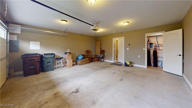 416 Elm St Unit B, Belpre, OH 45714 - garage featuring a garage door opener, electric panel, and baseboards