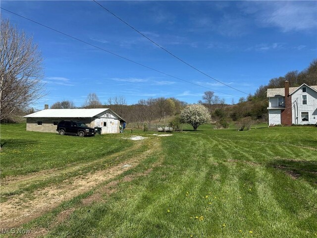 3882 State Route 60, Killbuck, OH 44637 - view of green lawn featuring an outbuilding