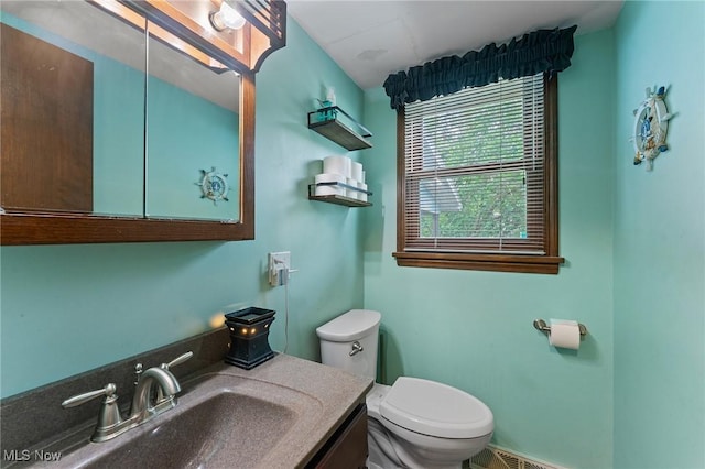 652 Meadowland Dr, Hubbard, OH 44425 - half bathroom featuring toilet and vanity
