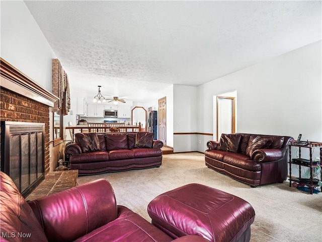 21428 Montclare Blvd, Strongsville, OH 44149 - living room featuring carpet floors, a fireplace, a textured ceiling, and a ceiling fan