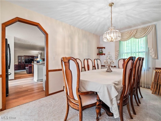 21428 Montclare Blvd, Strongsville, OH 44149 - dining space featuring a chandelier and light carpet